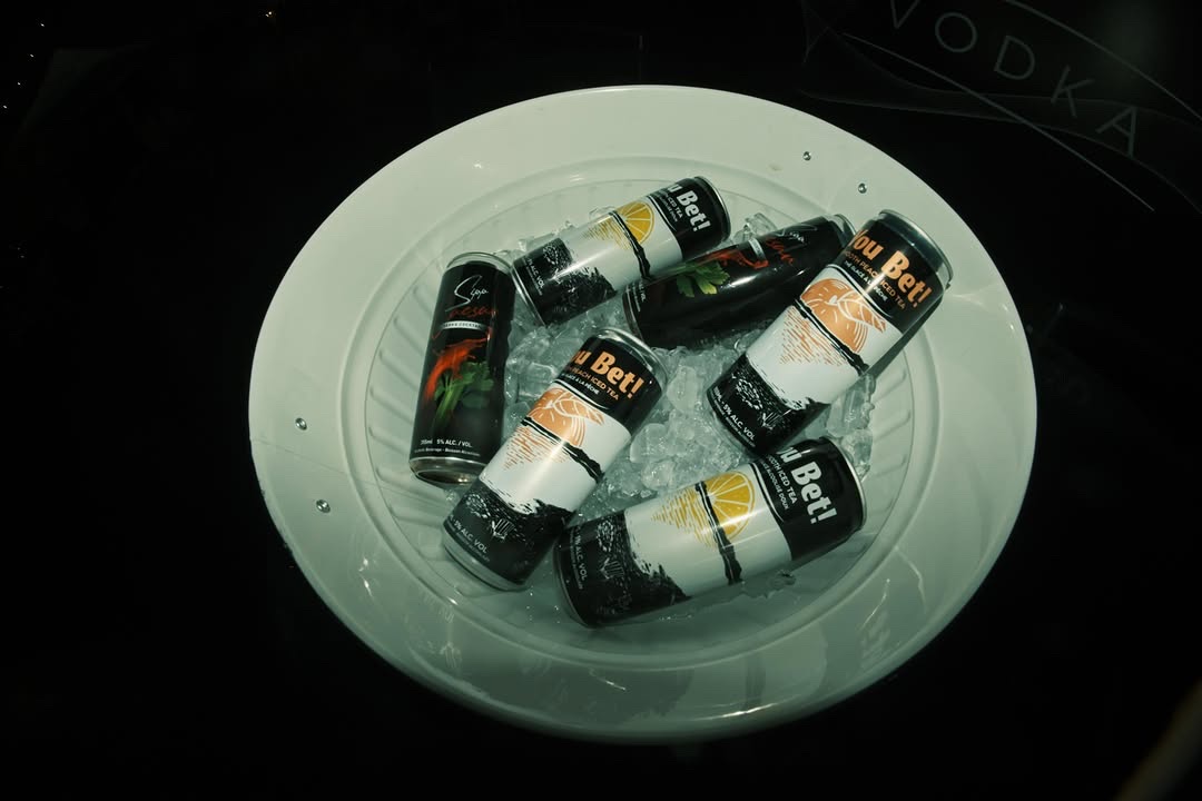 Sipp and You Bet cans on ice in a bowl, set against a VODKA backdrop